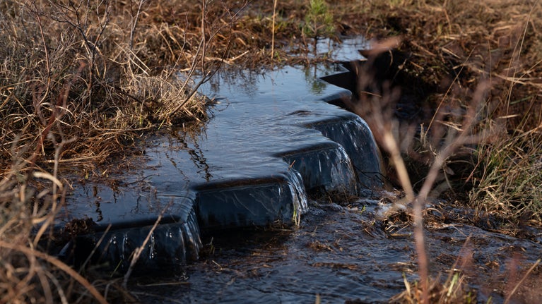 Weirs installed to reduce water flow and loss of water across the site